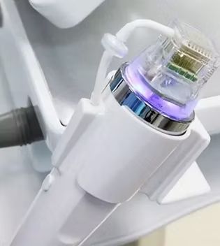 A close up of a machine with a purple light on it.