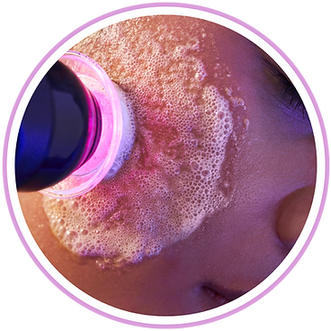 A close up of a person 's face being cleaned with a brush.