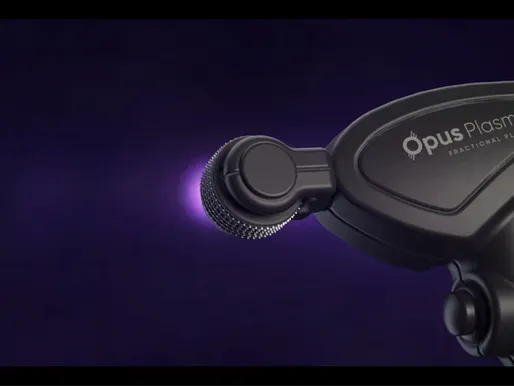A close up of a opus plasma device on a purple background
