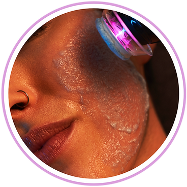 A close up of a woman 's face with a purple light on it