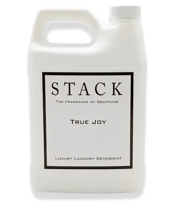 A white bottle of stack true joy laundry detergent