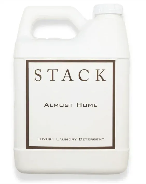 A gallon of stack almost home luxury laundry detergent