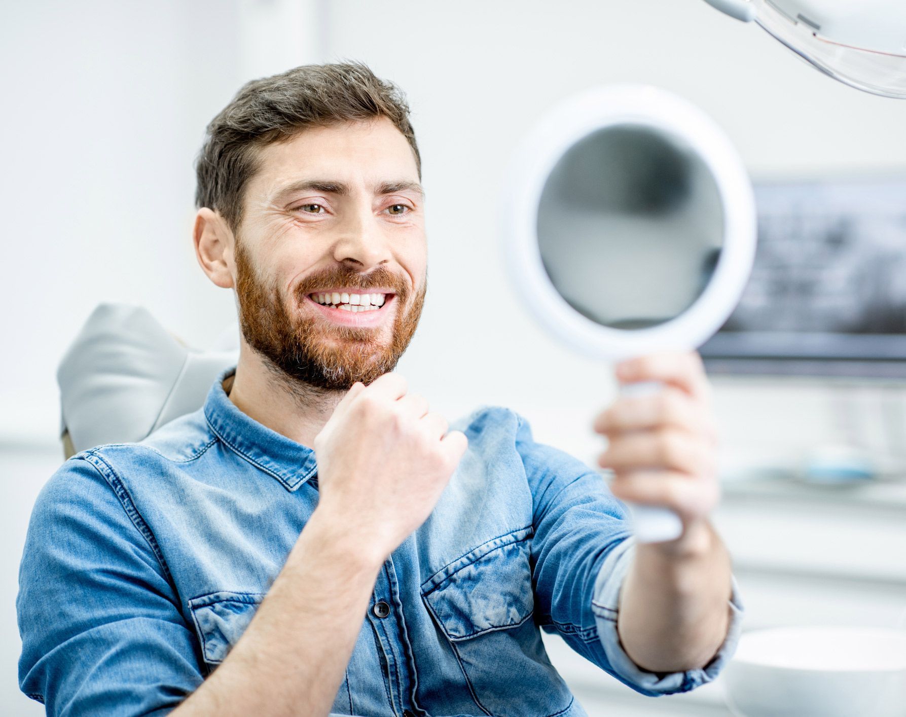 Man Checking his Cleaned Teeth — Munster, IN — SMILE Design Man Checking his Cleaned Teeth — Munster, IN — SMILE Design