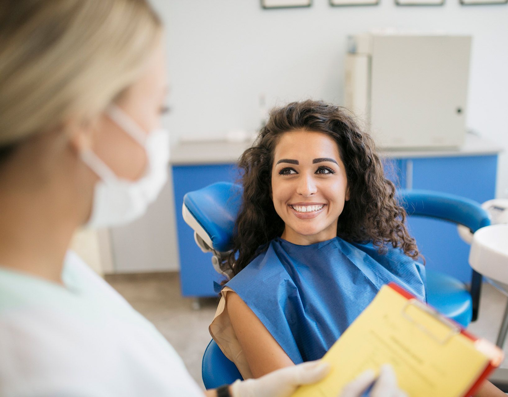 Woman Preparing for Tooth Extraction — Munster, IN — SMILE Design Woman Preparing for Tooth Extraction — Munster, IN — SMILE Design
