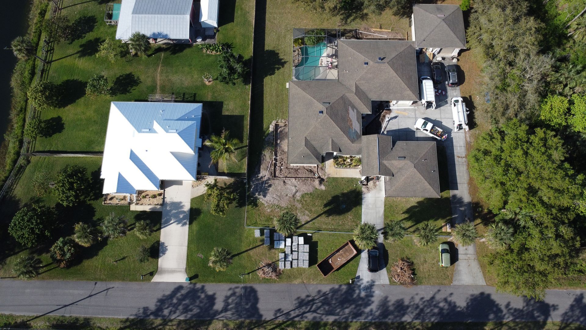 An aerial view of a house with an arrow pointing to it