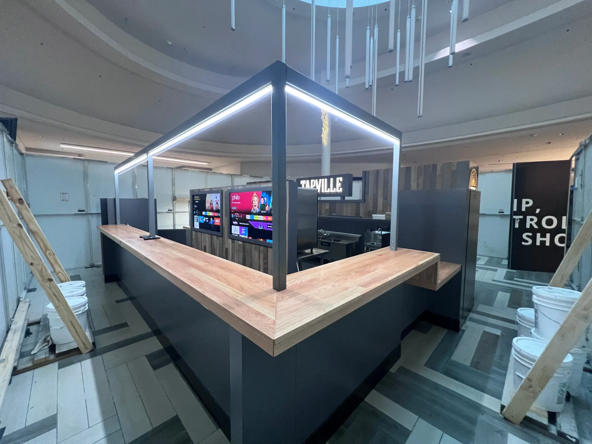A large room with a wooden counter and a sign that says ip trol sho