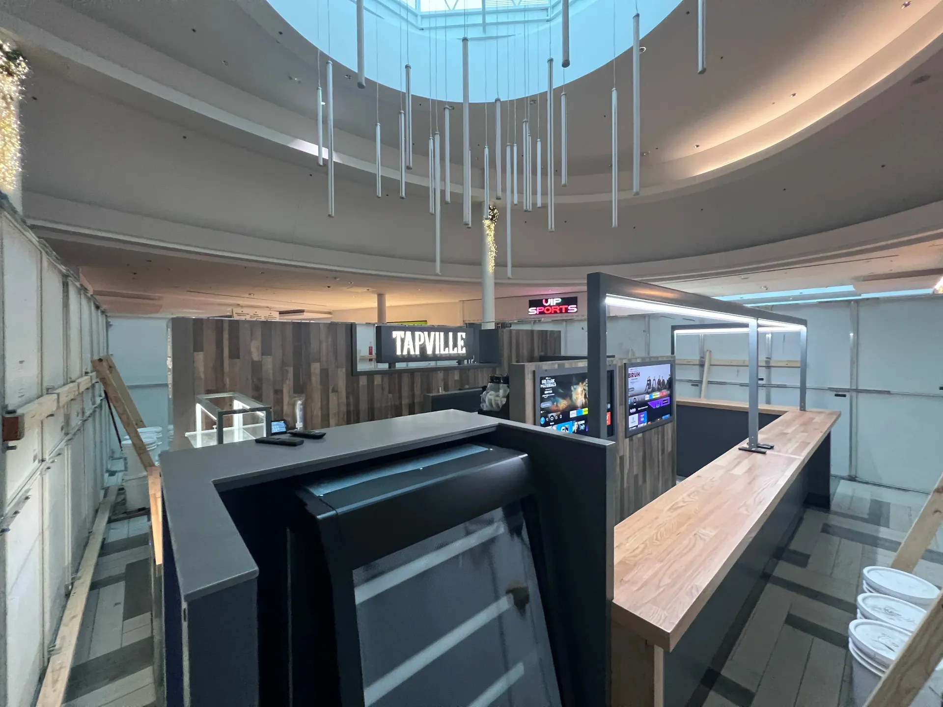 An artist 's impression of a restaurant with a sign that says tipville