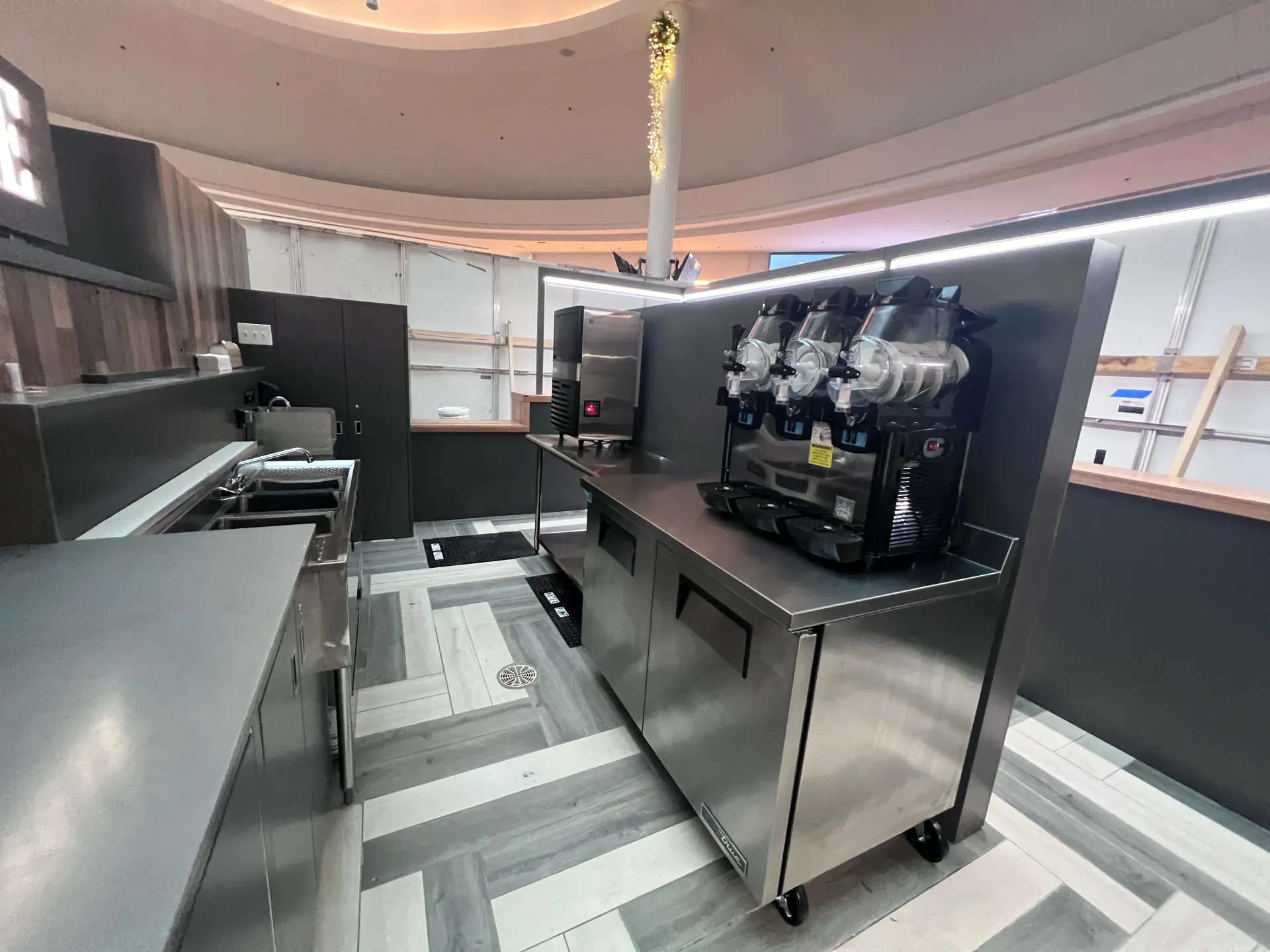 A kitchen with stainless steel appliances and a sink.