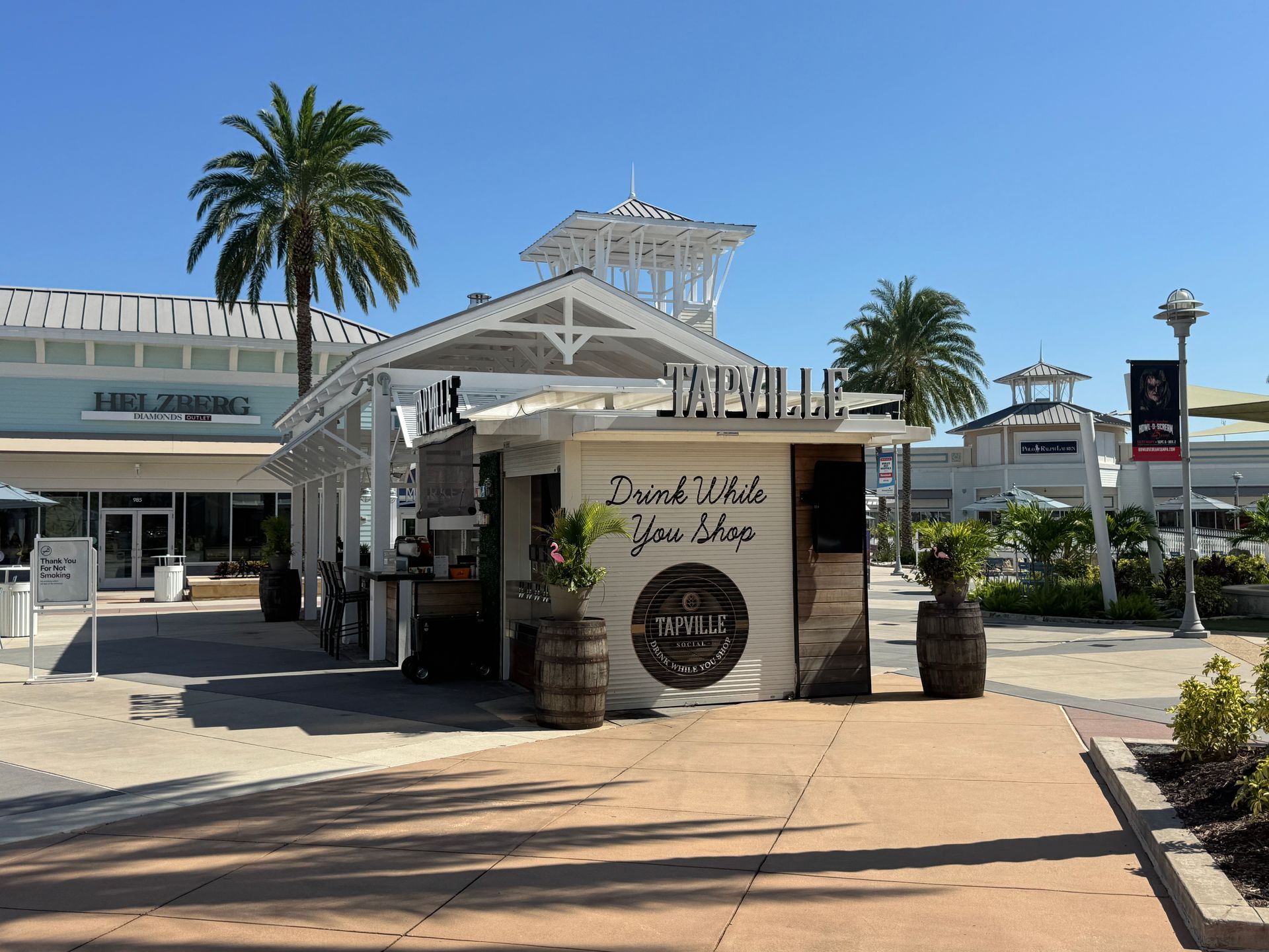 A store front with a sign that says drink what you like