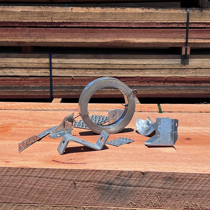 A Bunch of Metal Pieces Are Sitting on Top of a Wooden Table — B & B Timbers Ballina In West Ballina, NSW