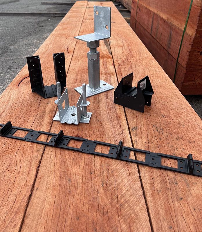 A Wooden Table With a Bunch of Metal Pieces on It — B & B Timbers Ballina In West Ballina, NSW