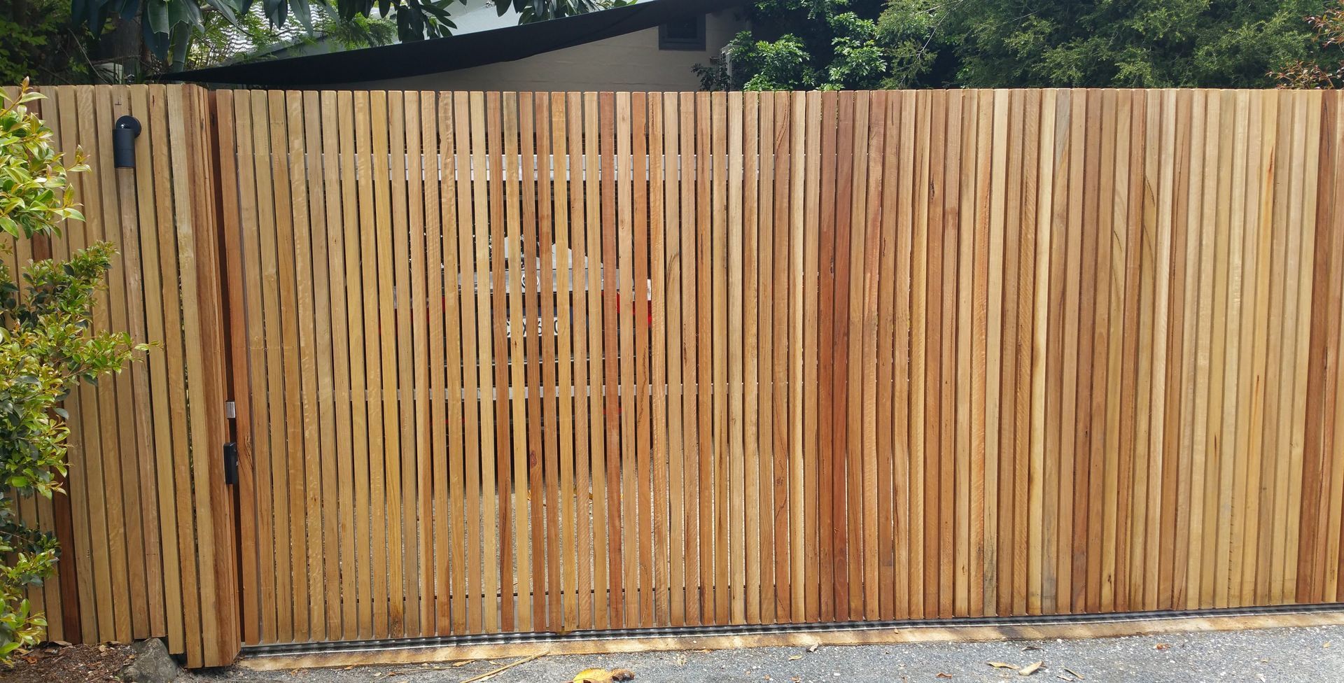 A Wooden Fence With a Gate in Front of a House — B & B Timbers Ballina In West Ballina, NSW