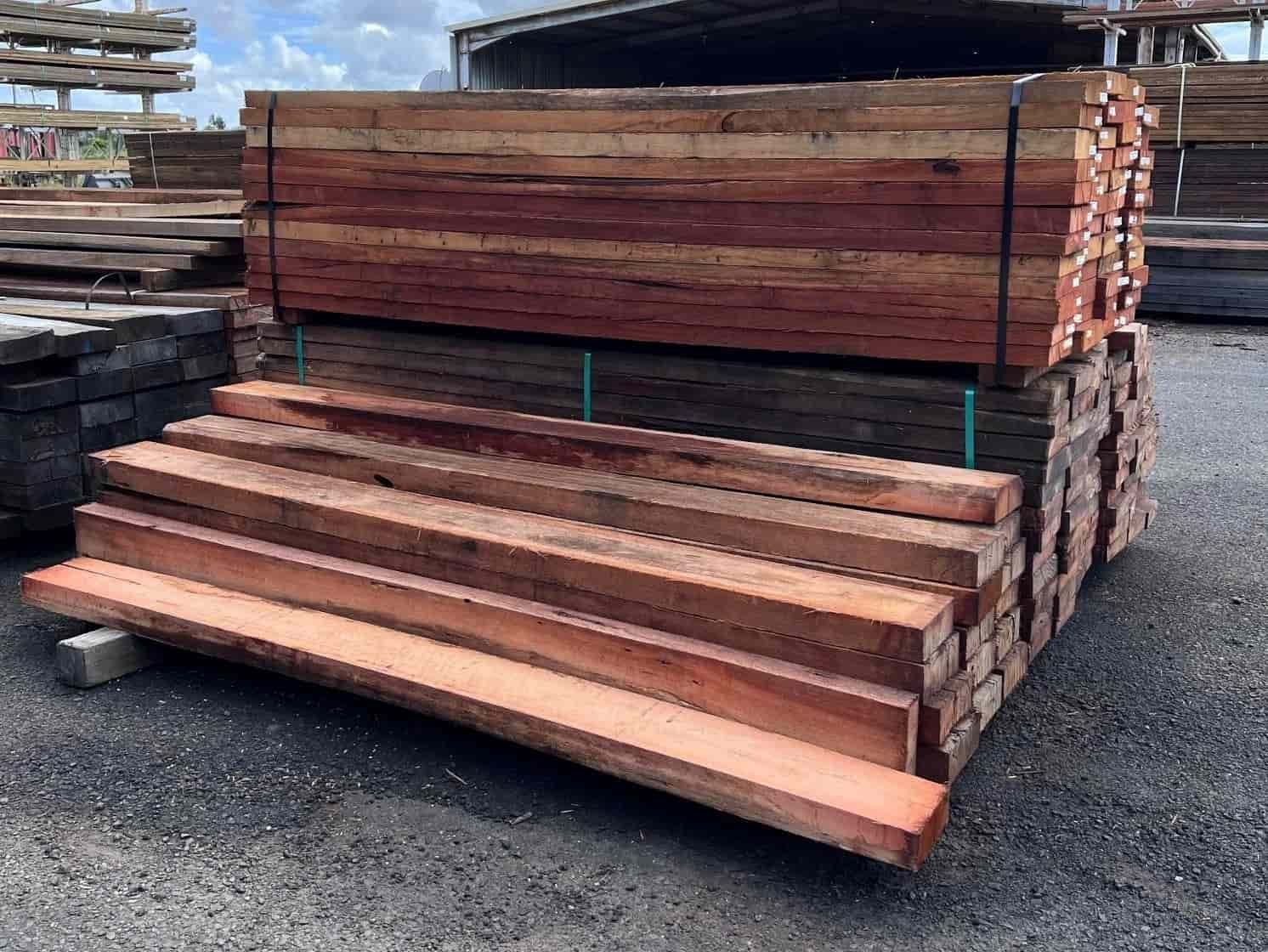 A Pile of Wood is Stacked on Top of Each Other in a Parking Lot — B & B Timbers Ballina In West Ballina, NSW