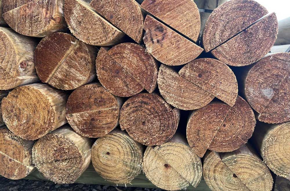 A Pile of Logs Stacked on Top of Each Other — B & B Timbers Ballina In West Ballina, NSW