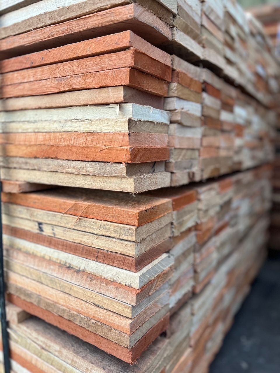 A Pile of Wooden Boards Stacked on Top of Each Other — B & B Timbers Ballina In Byron Bay, NSW