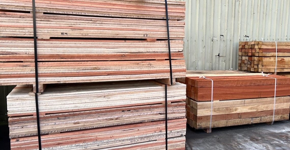 A Pile of Wood is Stacked on Top of Each Other in a Warehouse — B & B Timbers Ballina In West Ballina, NSW