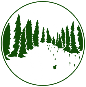 Green trees border a path through a forest, within a green circle.