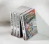 Stack of paperback books, with one titled “Under the Mango Tree” standing in front.