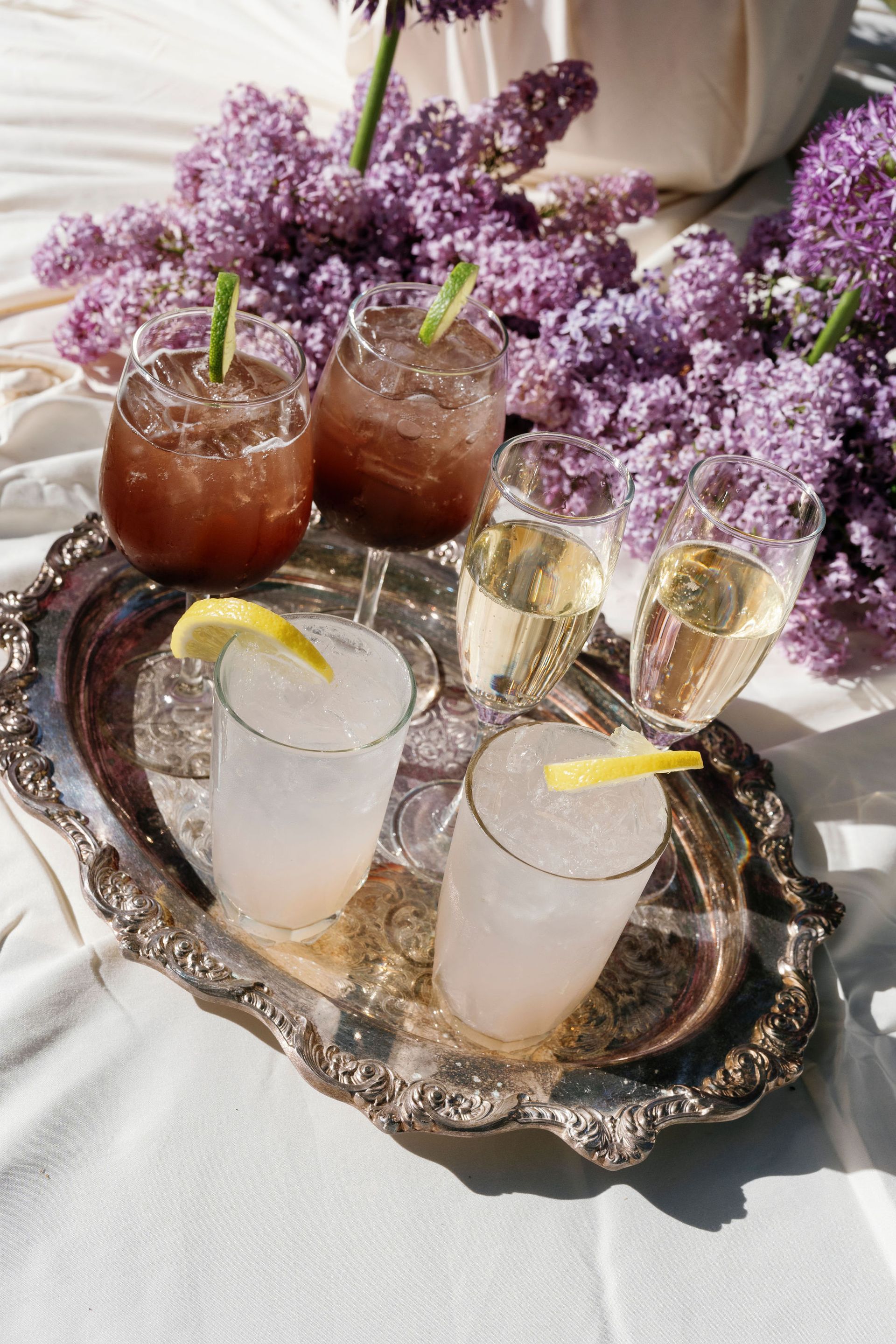 A long table with purple flowers in front of it