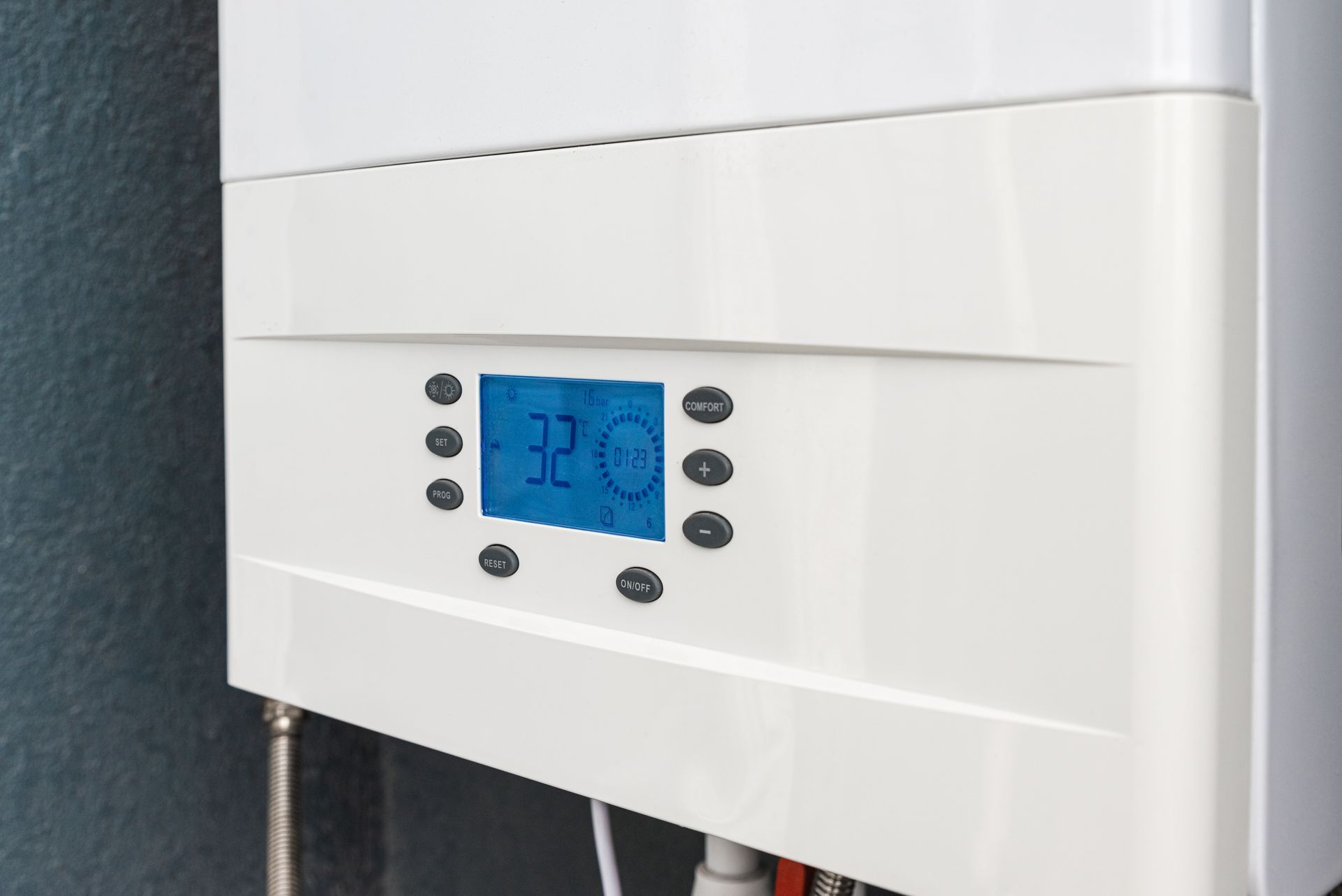 Wall-mounted white boiler with blue digital display and control buttons