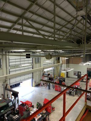 An aerial view of a factory with a red railing