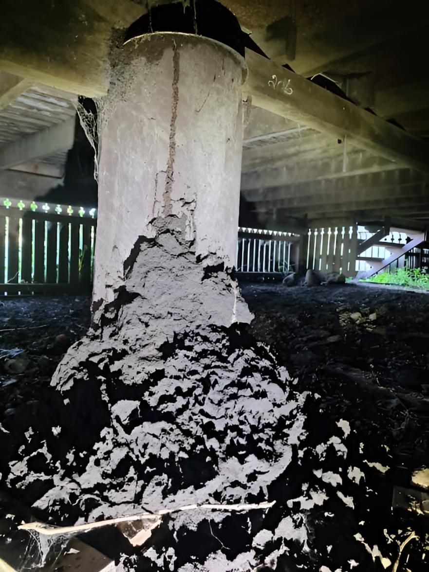 Pile of Dirt is Sitting Under a House — Keiran Mortimer Pest Control in Wilsonton, QLD