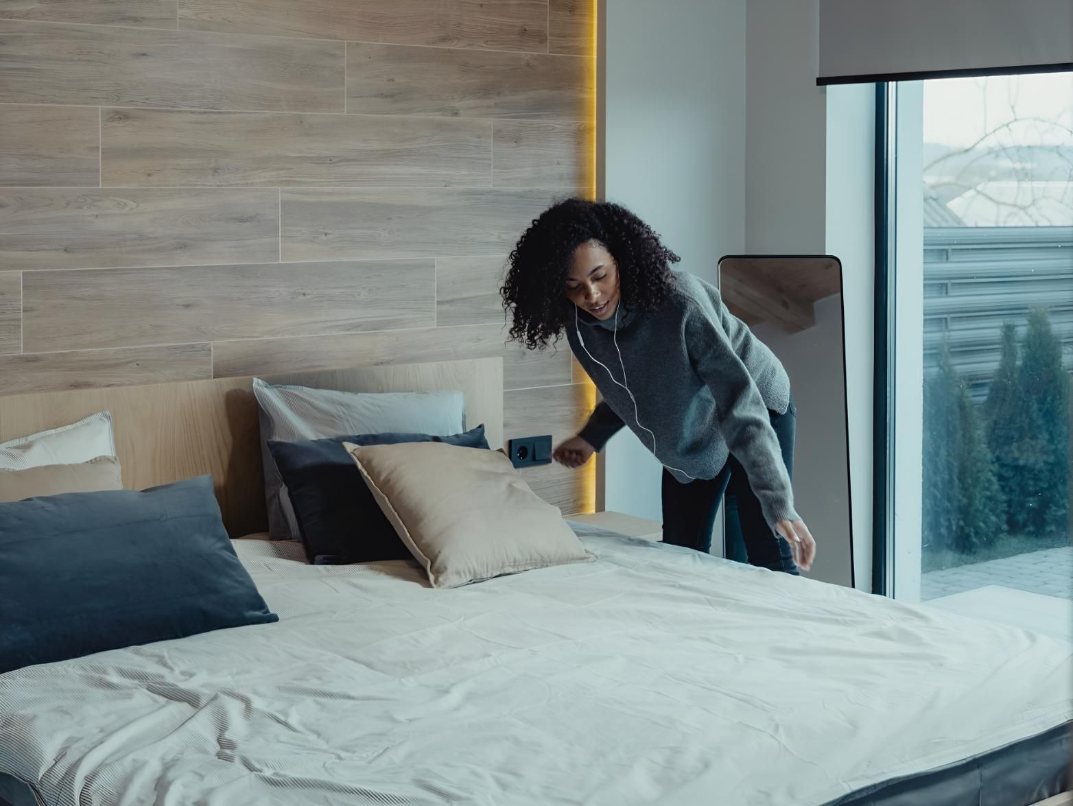 Woman is Cleaning the Bed — Keiran Mortimer Pest Control in Wilsonton, QLD
