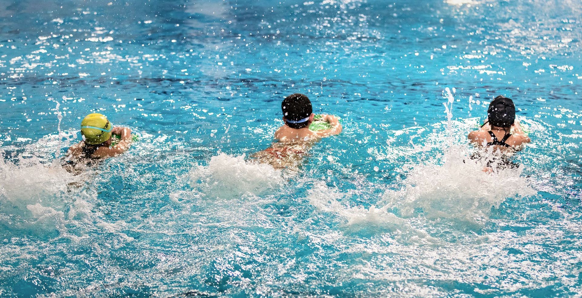 A variety of kids in swim class