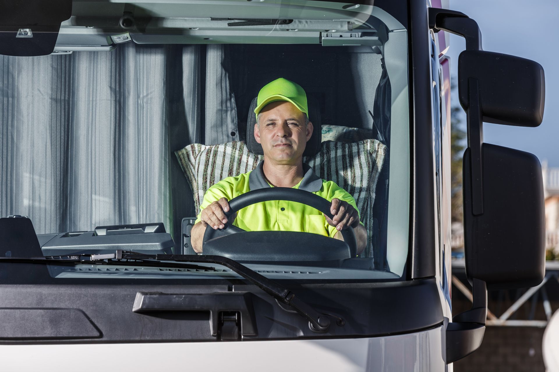 A man driving a truck A man driving a truck