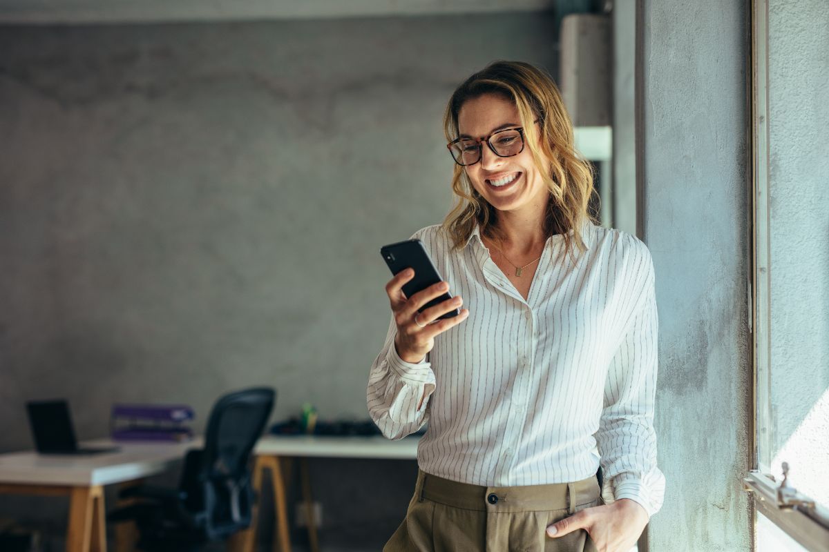 Woman Using Mobile Phone — Phoenix, AZ — Provision Networks