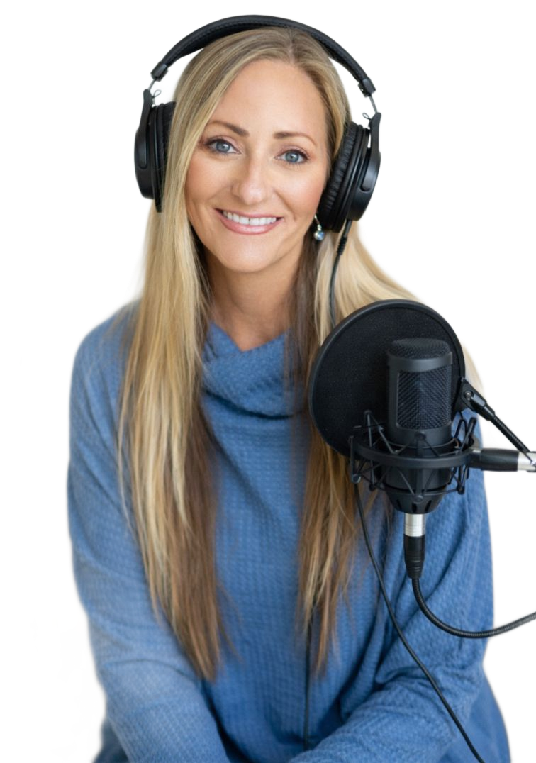 Smiling woman in a blue sweater wearing headphones, speaking into a studio microphone