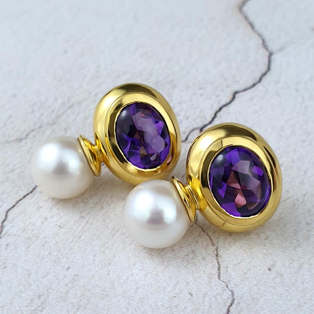 Gold earrings with buff-top Amethsts and cultured pearls.