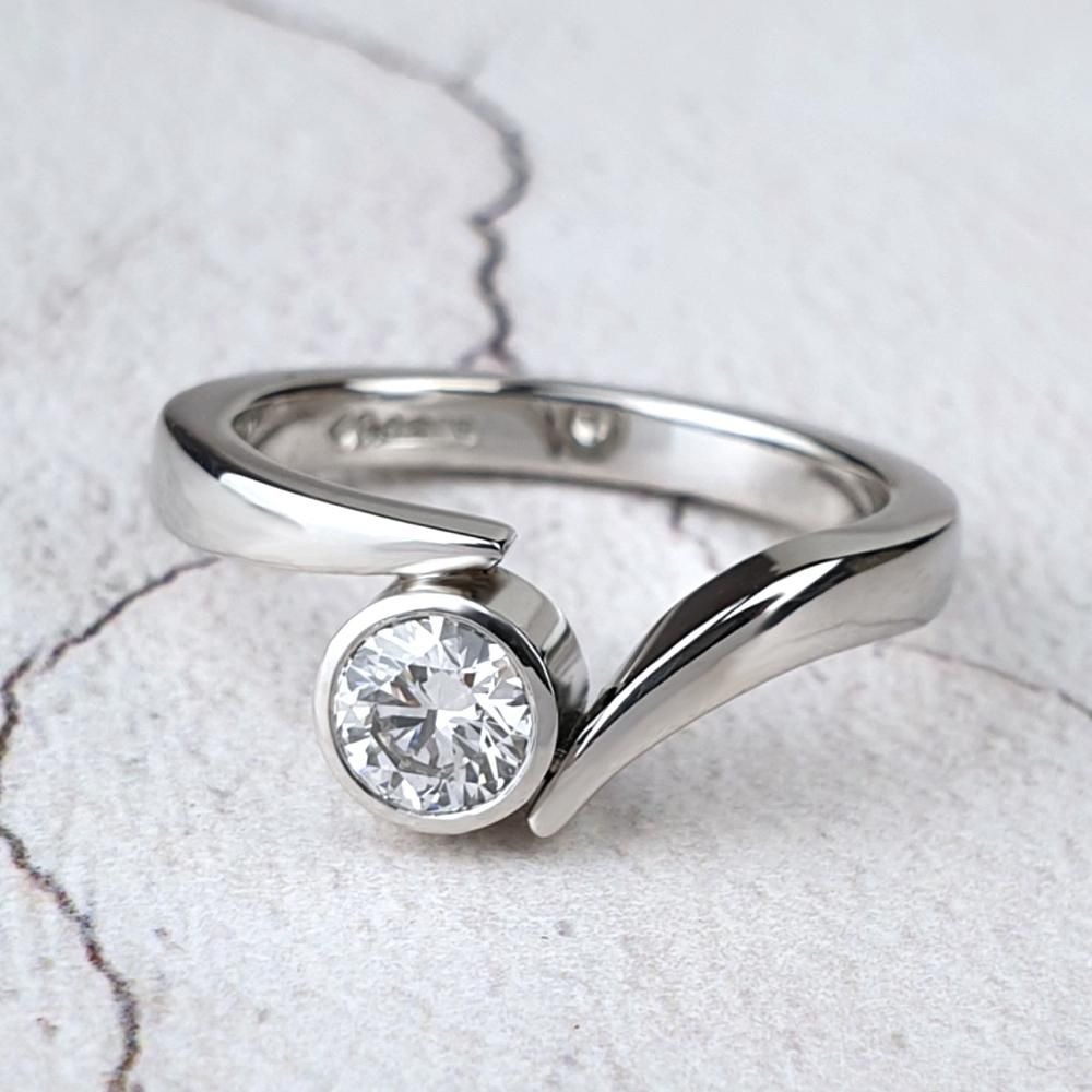 Platinum Flick engagement ring with round diamond Contemporary platinum engagement ring made in Worthing by Aurum jewellers