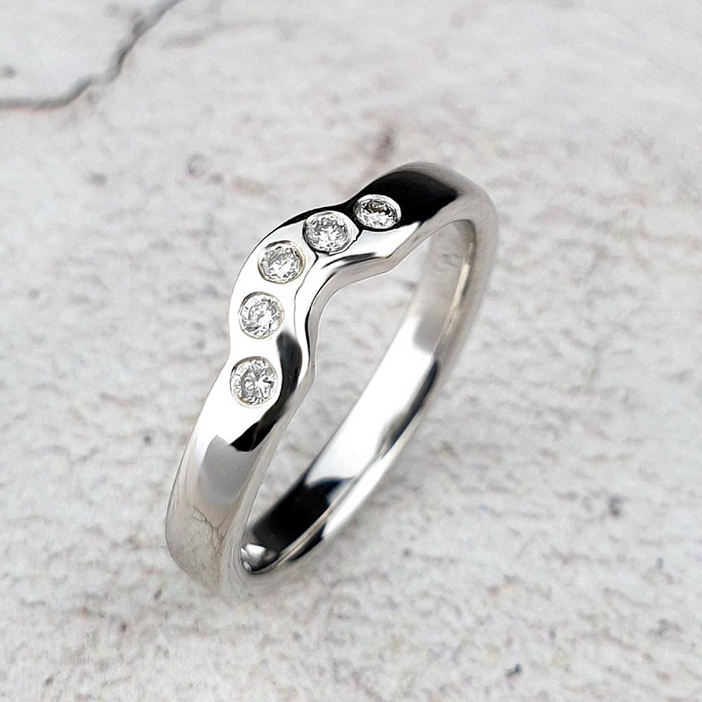 Fitted eternity ring with gypsy-set diamonds
