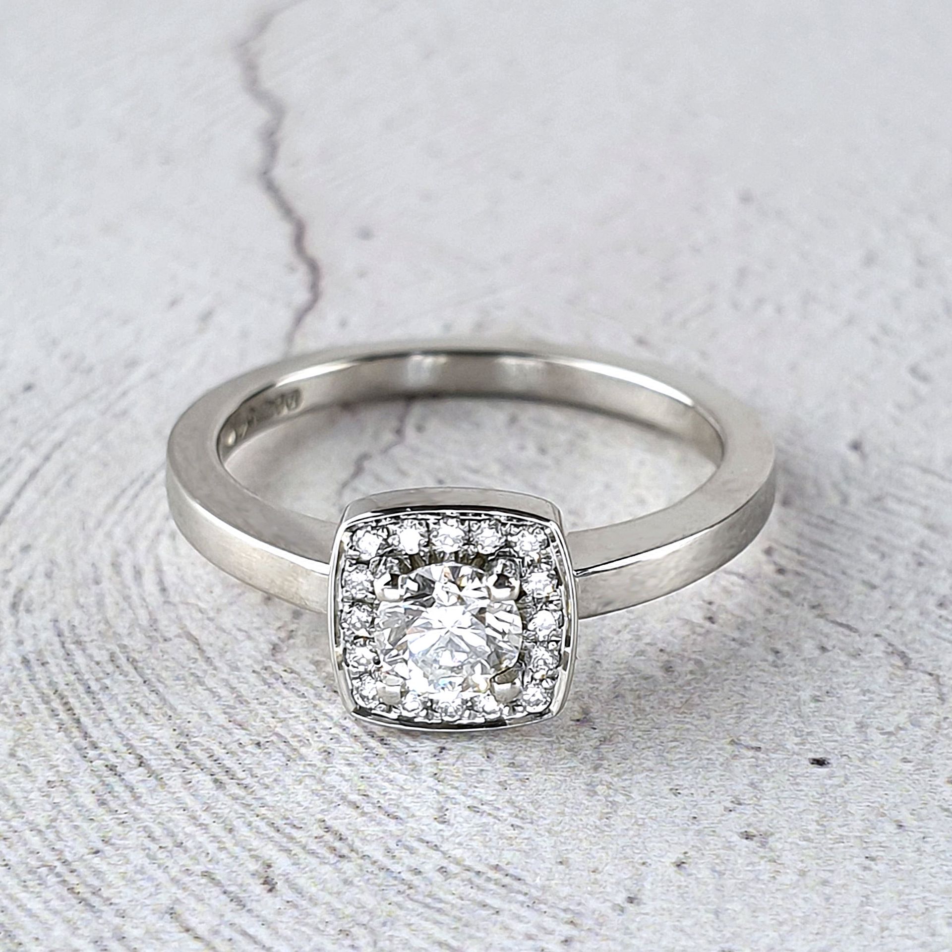 Cushion shaped halo ring with diamonds Horsham