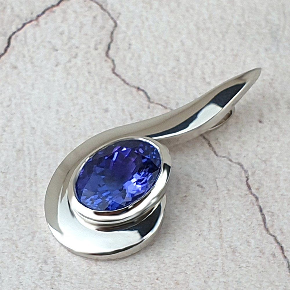 Bespoke contemporary platinum pendant with oval Tanxzanite