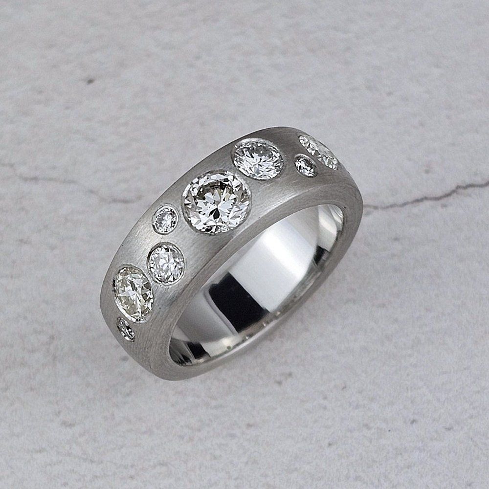 matte platinum band ring with scattered diamonds