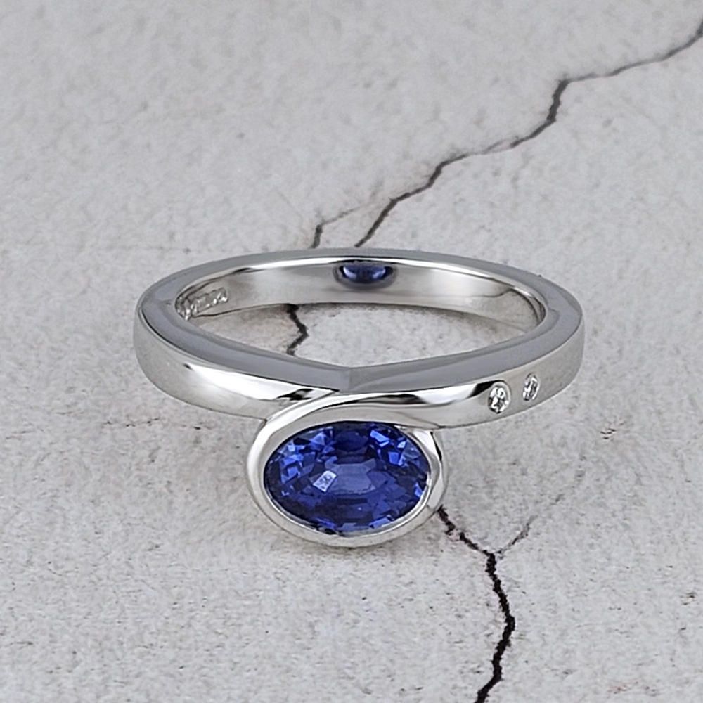 An infinity ring with an oval blue sapphire Bespoke Infinity ring with an oval blue sapphire by Worthing jeweller Aurum