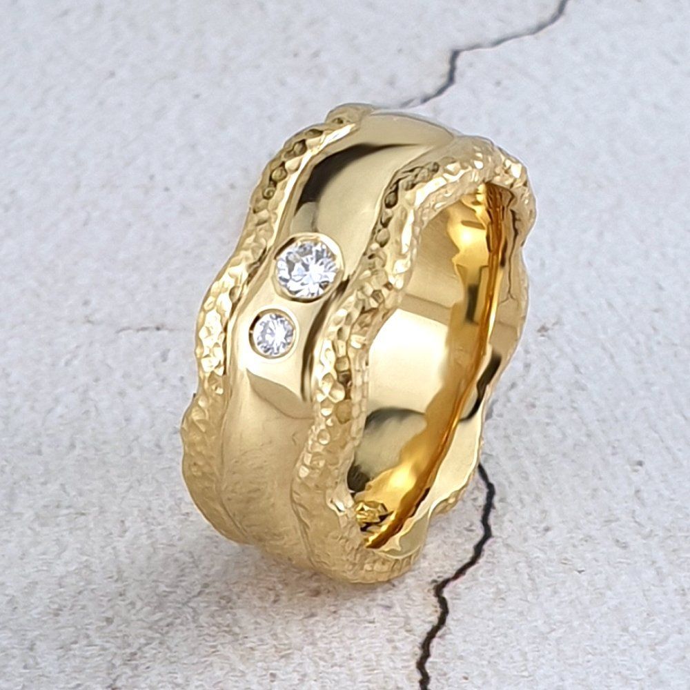 carved gold band with textured edges