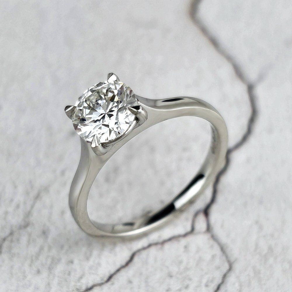 solitaire engagement ring with four talon claws