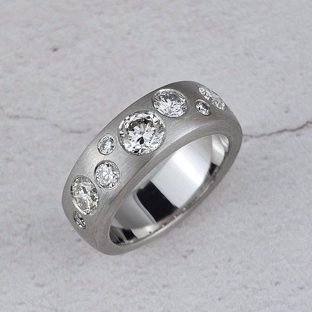 Platinum wedding band with scattered diamonds