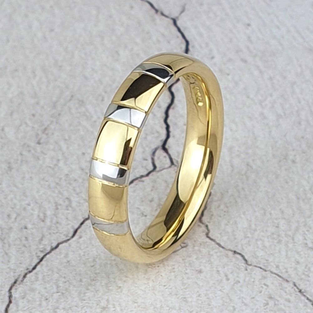a yellow gold court wedding ring with platinum stripes