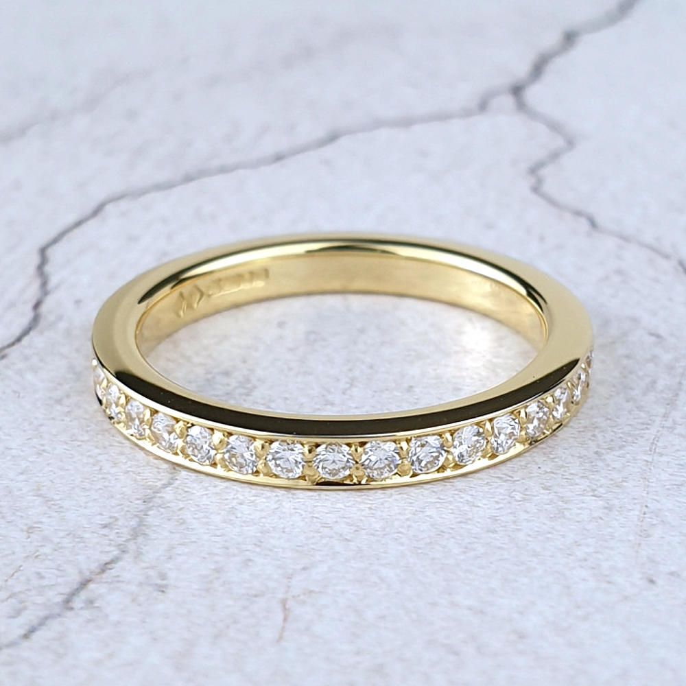 Yellow gold wedding ring with diamonds