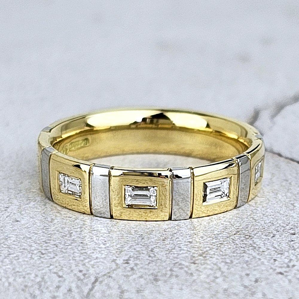 man's gold and platinum wedding ring with baguette diamonds