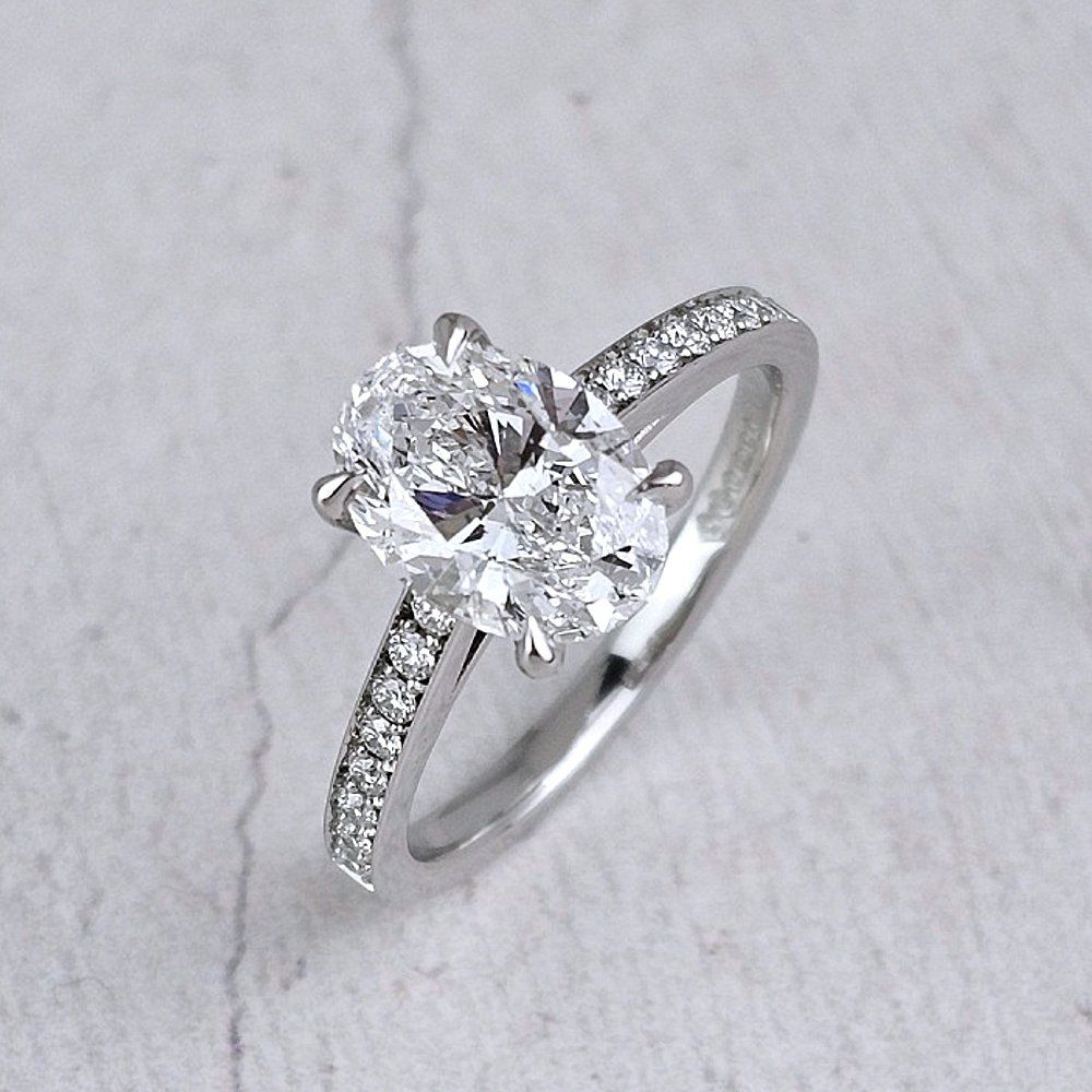 Emerald cut diamond engagement ring with baguette shoulders