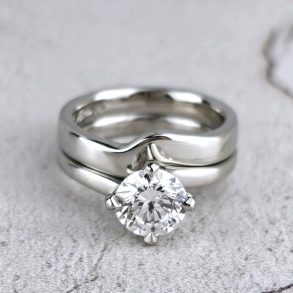 a custom fitted wedding ring shown with the customer's engagement ring