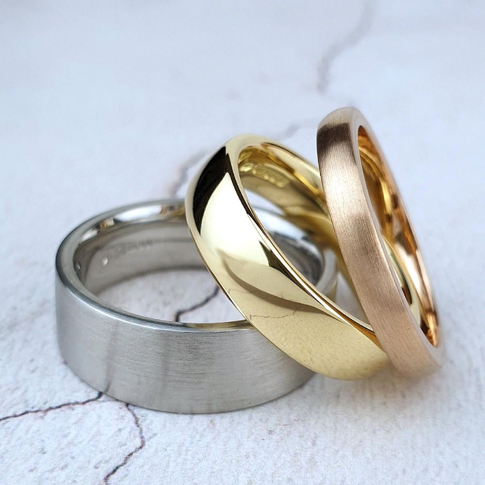 Platinum, yelloe, and rose gold wedding bands