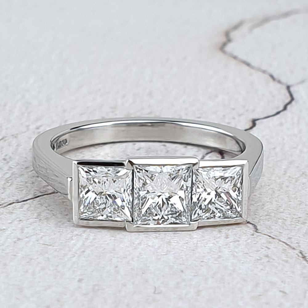 Platinum Trilogy engagement ring with princess-cut diamonds Platinum Trilogy engagement ring with princess-cut diamonds
