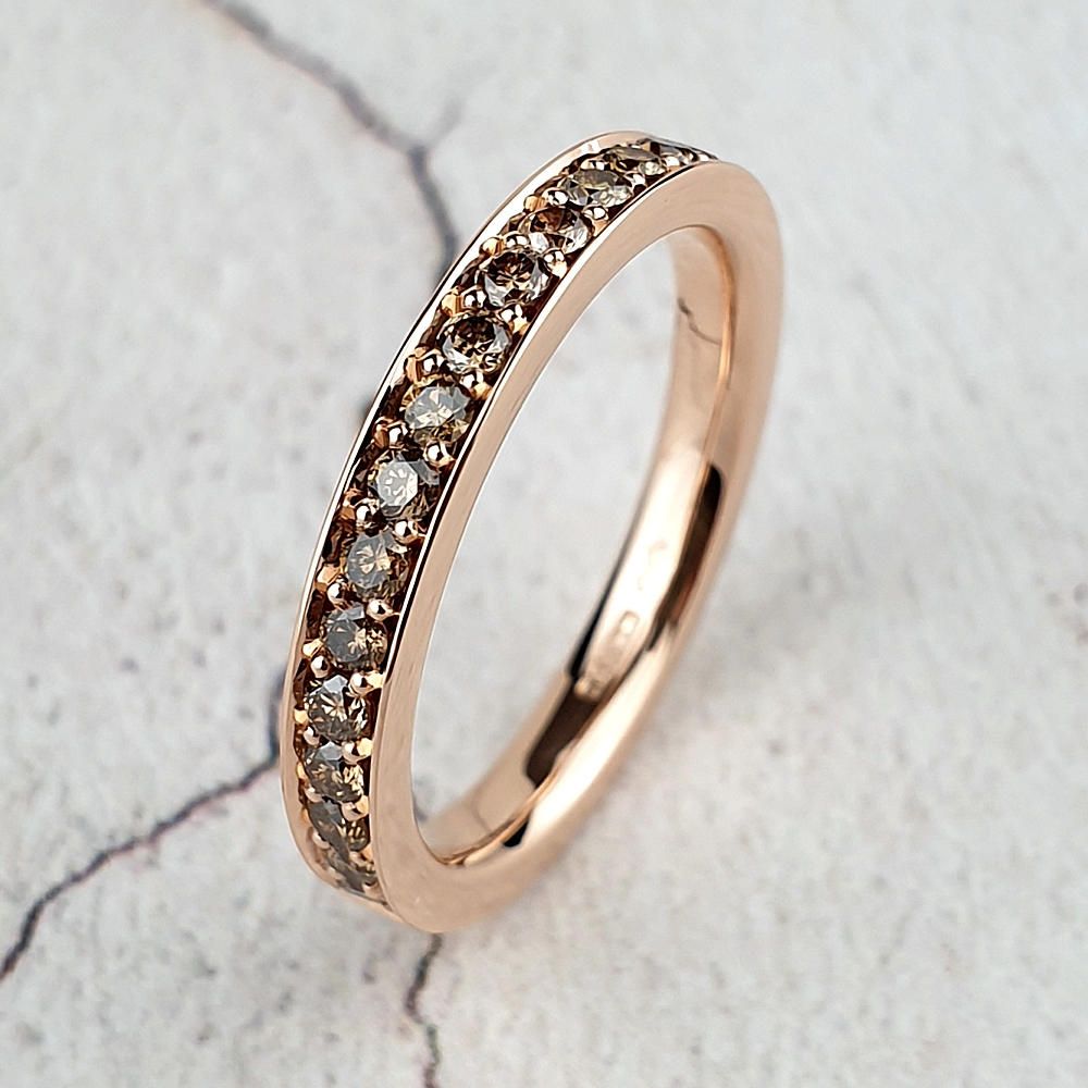 Red gold wedding ring with brown diamonds
