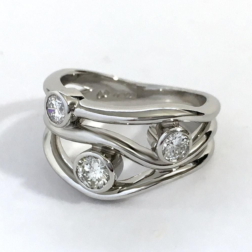 platinum dress ring with three diamonds